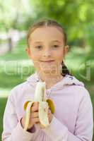Girl holds banana