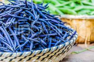 Green blu beans in a wicker basket