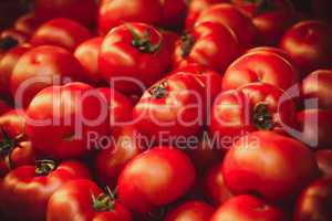 Fresh organic tomatoes at market background texture