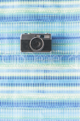 Vintage photocamera on blue background