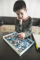 Child and puzzle.