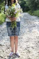 Woman hold bouquet of flowers