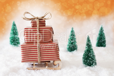 Christmas Sleigh With Orange Background On Snow