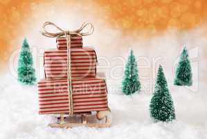 Christmas Sleigh With Orange Background On Snow