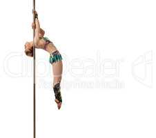 Sport and dance. Red-haired gymnast posing on pole