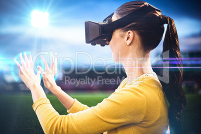 Composite image of woman using an oculus Composite image of woman using an oculus