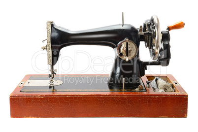 Antique sewing machine isolated on white