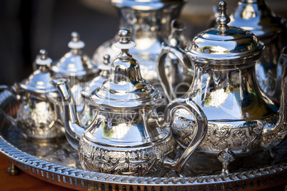 Table setting with silver tea or coffee cups