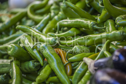 green chili peppers on sale at the market