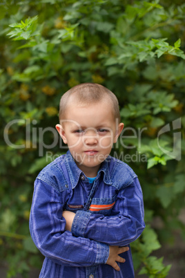 Portrait of a boy close up in nature