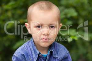 Portrait of a boy close up in nature