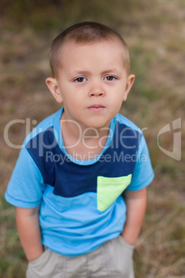 Portrait of a boy close up in nature