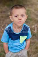 Portrait of a boy close up in nature