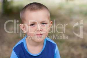 Portrait of a boy close up in nature