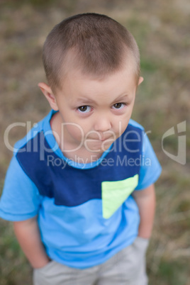 Portrait of a boy close up in nature