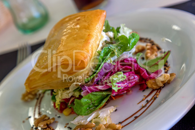 Salad with goat cheese in the restaurant