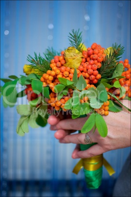 bouquet of ashberry in the hands