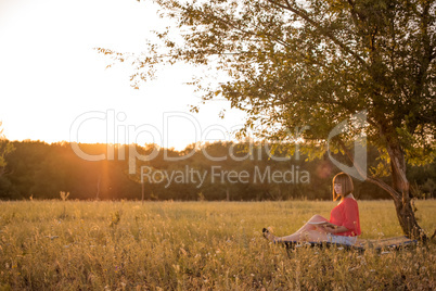 Girl with a book on nature