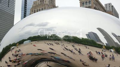 Tourists at the Chicago Bean Monument in Millennium Park Closeup