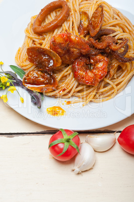 Italian seafood spaghetti pasta on red tomato sauce