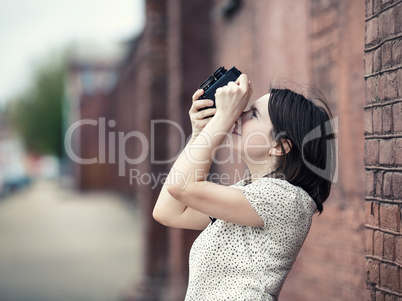 Girl taking photo outdoors