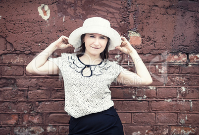 Posing woman in hat