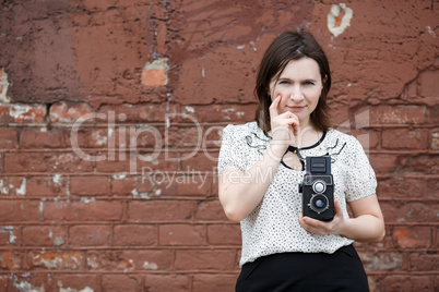 Woman with an old camera