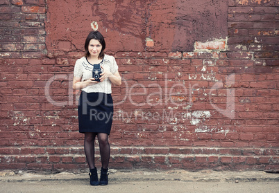 Woman holding retro camera