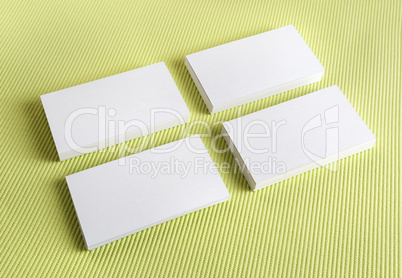 White business cards on a green background