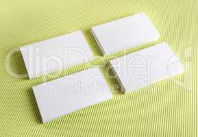 White business cards on a green background