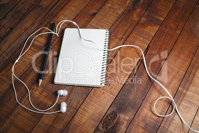 Diary, pencil and headphones