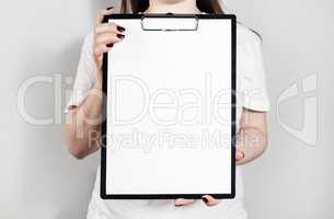 Woman holding clipboard
