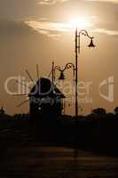 Silhouette of windmills at sunrise