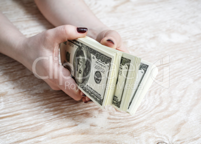Dollars in hands