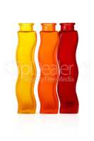 Three bottles of colored glass