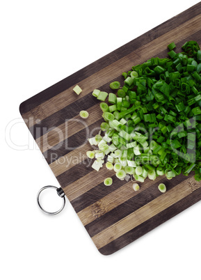 Green chopped onions on a cutting board