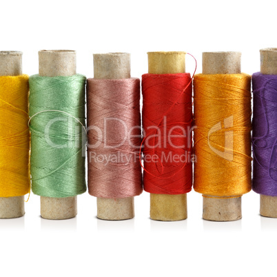 Several spools of colored threads