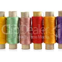 Several spools of colored threads