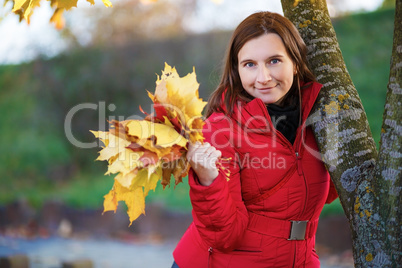 Woman with maple leaves