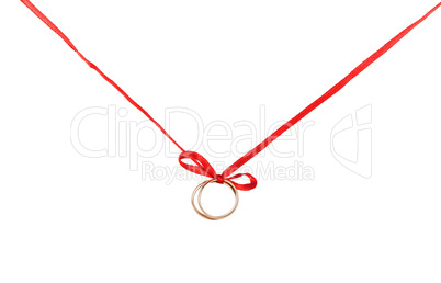 Golden rings on a red ribbon
