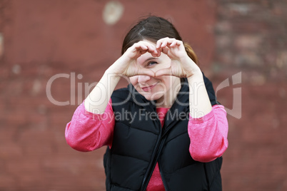 Woman showing heart