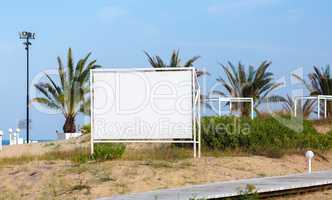 Billboard on the background of palm trees