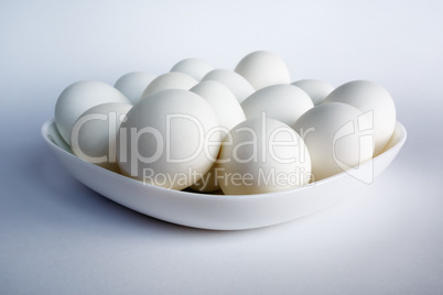 White eggs in the dish