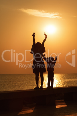 Mother and daughter at sunrise