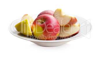 Apples on a white plate