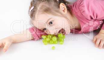 Child eats grapes