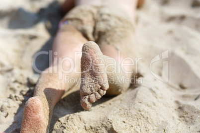 Child's feet in the sand