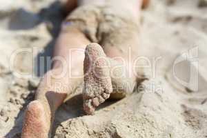 Child's feet in the sand