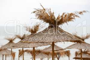 Straw beach umbrellas
