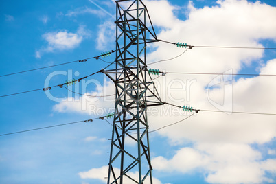 Electricity pylon against blue sky